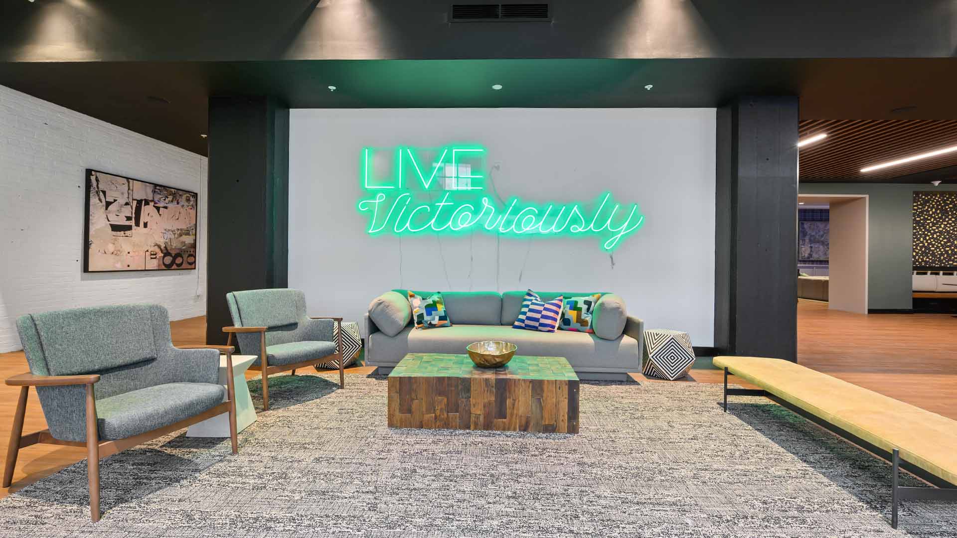 The Victor lounge with seating and neon sign - St. Louis, MO